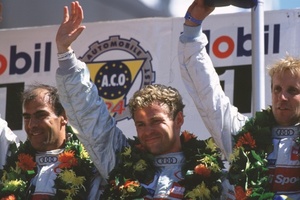 Emanuele celebrating with Frank Beila and Ton Kristensen winning the 2000 Le Mans 24h race.
